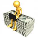 74125_bigstock_gold_guy_online_with_money_6741622.